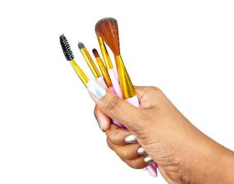 Hand with Makeup Brushes on White Background Stock Photos