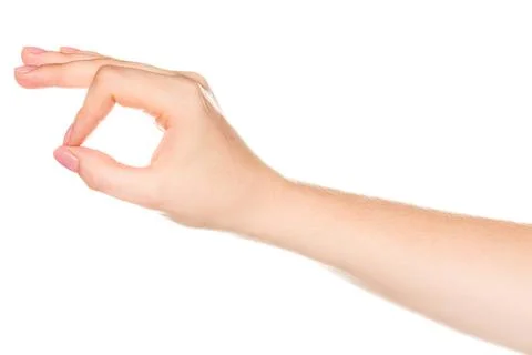 Hand making a circle gesture on a light background during daytime Stock Photos