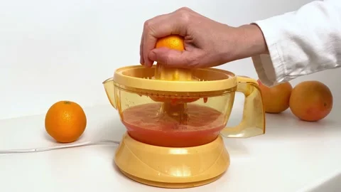 Hand making fresh orange juice Stock Footage 166027160