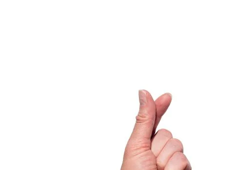 A hand making a heart shape with two fingers on a white isolated background.  Stock Photos