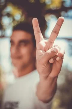 Hand making peace and victory sign Foto stock