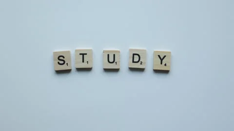 Hand making phrase study online with wooden letters on white background. online Stock Footage 157673638