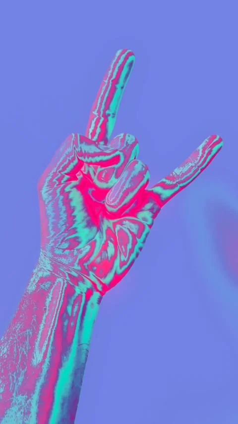 A hand making a rock and roll horns sign in psychedelic blue and pink lighting Stock Footage 277229882