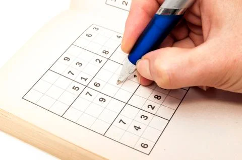 Hand making a sudoku Stock Photos