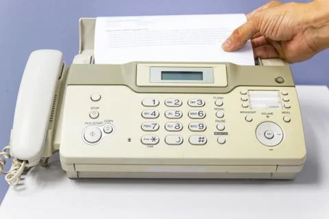 Hand man are using a fax machine in the office 스톡 사진