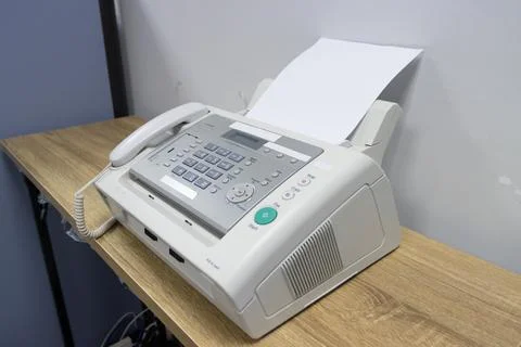 Hand man are using a fax machine in the office, equipment Stock Photos