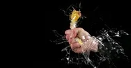 Hand Of Man Breaking A Chicken Egg Against Black Background, Slow Motion 4K Stock Footage