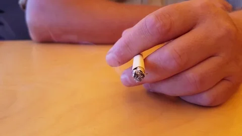 Hand of a man a cigarette smokes Stock Footage 80462543