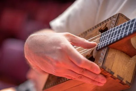 Hand of man in classical guitar. Stock Photos