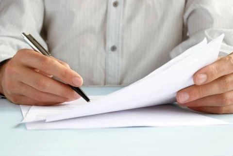 The hand of the man does entries in official papers Stock Photos