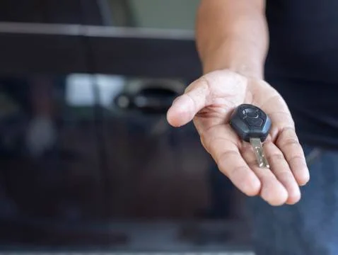 Hand man hode car remote for open the car. Soft focus and focus selective rem Stock Photos
