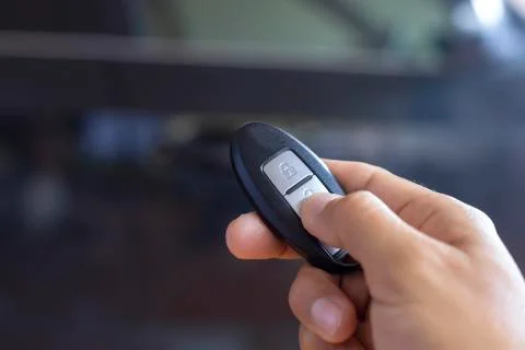 Hand man hode car remote for open the car. Soft focus and focus selective rem Stock Photos
