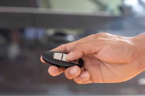 Hand man hode car remote for open the car. Soft focus and focus selective rem Stock Photos