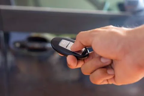 Hand man hode car remote for open the car. Soft focus and focus selective rem Stock Photos