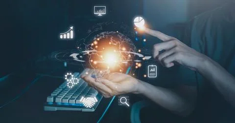 Hand of man hold and touch virtual global with hologram and using computer .. Stock Photos