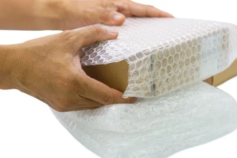 Hand of man hold bubble wrap, for protection parcel product cracked or insura 스톡 사진