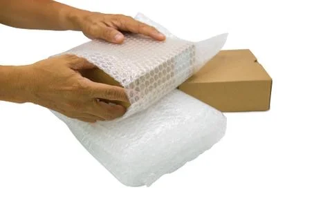 Hand of man hold bubble wrap, for protection parcel product cracked or insura 스톡 사진