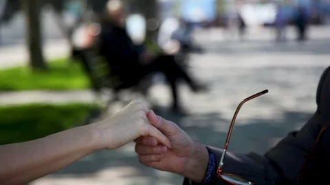 Hand of a Man holding the hand of a young Woman, close- up Video stock 114263953