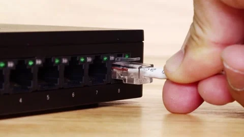 Hand of man holding The network cables to connect Lan port Stock Footage 149644727