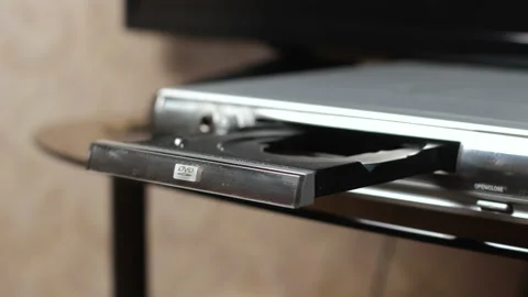 Hand of Man Inserting DVD Disk into Video Player Stock Footage 151881333