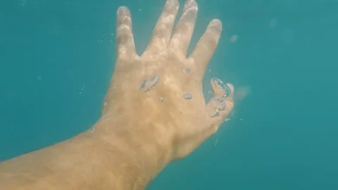 The hand of a man in need of help in the sea. Rescue the drowning Stock Footage 91748110