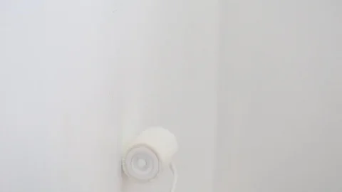 Hand of man paint interior house of white room Stock Footage 112583053