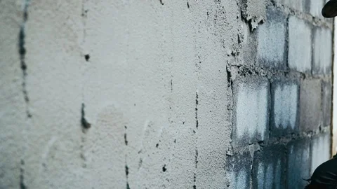 Hand of man plastering concrete build a wall. Video stock 116584963
