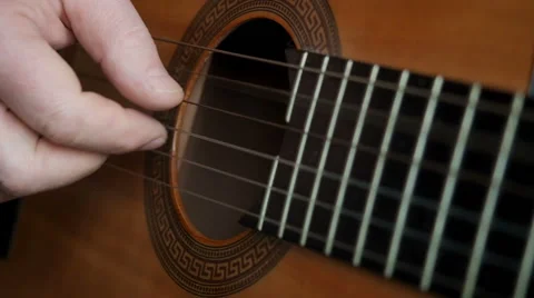 Hand of man playing guitar Stock Footage 61240636