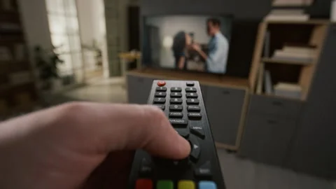 Hand of Man Pressing Button on Remote to Turn Off Love Drama on TV Stock Footage 331041716