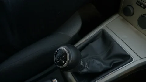 Hand of man pulling the handbrake and changing gears Stock Footage 85597185