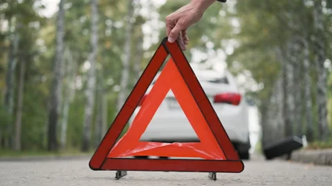 Hand of Man Putting Triangle by the Broken Car Video stock 160268569
