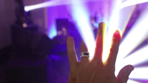 Hand man raising up to disco light Stock Footage 195210755