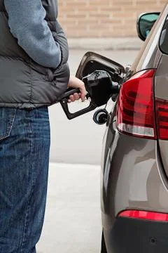 Hand of a man refueling a car Foto stock