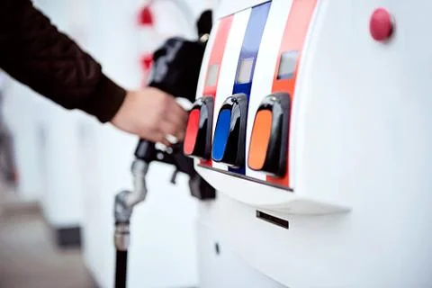 Hand of a man refueling a car Stock Photos