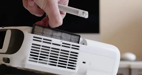 Hand of man removes dust filter from modern air conditioner Stock-Footage 199913821