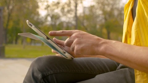 Hand of a man scrolling a tablet Stock Footage 121965588