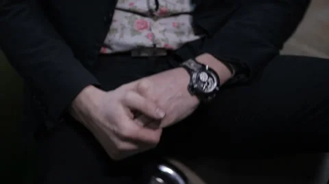 Hand man in a shirt with a clock Stock Footage 58834577