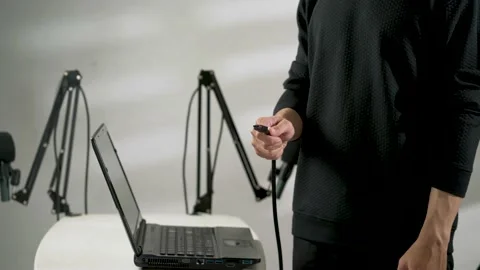 Hand of man showing a usb cable plug Stock Footage 156021962