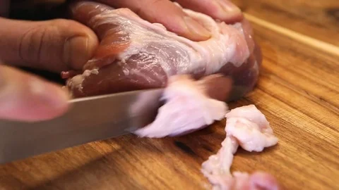 Hand of a man slices meat on a kitchen board Stock Footage 85163728