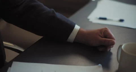Hand of a man in a suit lying on the table. Business meeting concept. Stock Footage 140206726