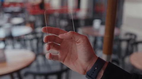 The hand of man in suit tapping on advanced virtual touchscreen smartphone Stock Footage 113341216