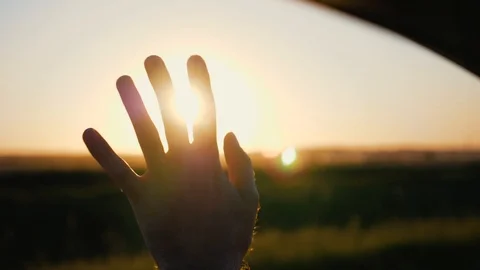 Hand of a man at sunset. Man's hand from the car window in the sun, slow motion 動画素材 91602341