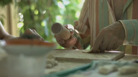 Hand Man Throws a Table With Flour and Rolls Raw Dough Stock video footage Stock Footage 65970539