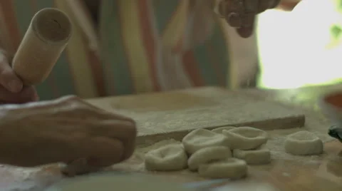 Hand Man Throws a Table With Flour and Rolls Raw Dough Stock video footage Stock Footage 65971357