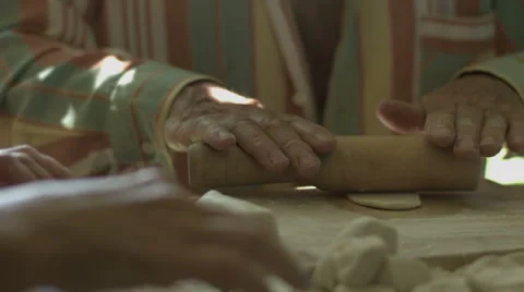 Hand Man Throws a Table With Flour and Rolls Raw Dough Stock video footage Stock Footage 65975808