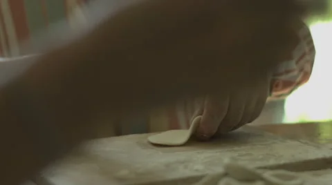 Hand Man Throws a Table With Flour and Rolls Raw Dough Stock video footage Stock Footage 65976250