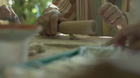 Hand Man Throws a Table With Flour and Rolls Raw Dough Stock video footage Stock Footage 65976606