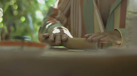 Hand Man Throws a Table With Flour and Rolls Raw Dough Stock video footage Video stock 65976931