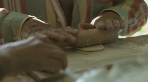 Hand Man Throws a Table With Flour and Rolls Raw Dough Stock video footage Video stock 65979291