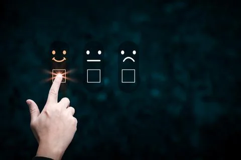 Hand man touching the virtual screen on the happy smile face icon to give s.. Stock Photos